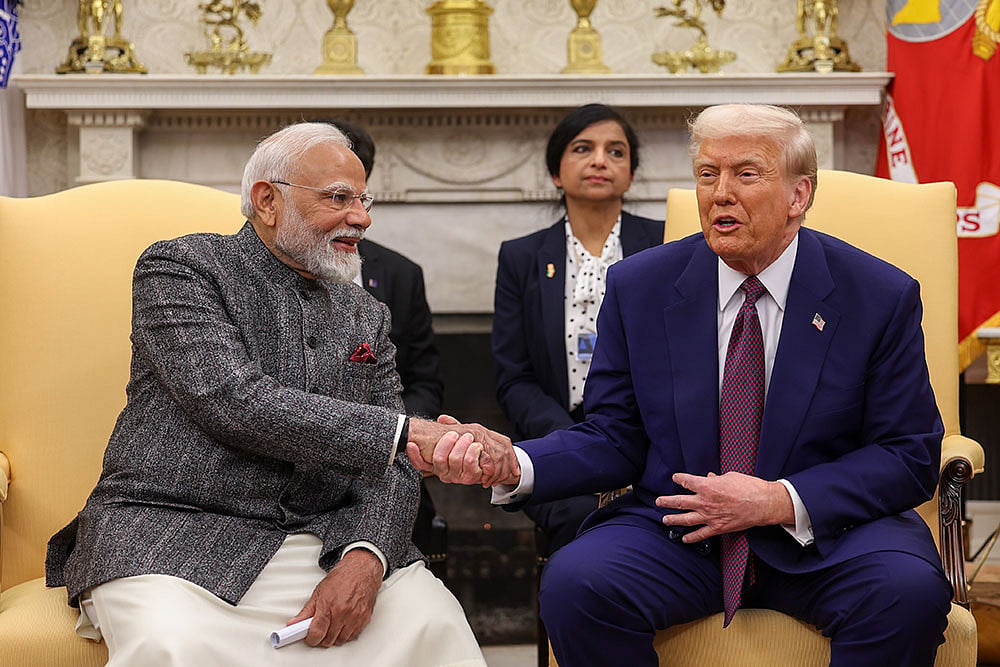 | Photo: PMO via PTI : PM Modi and President Trump hold bilateral talks, Russian drone strikes Chernobyl reactor shell, and more.