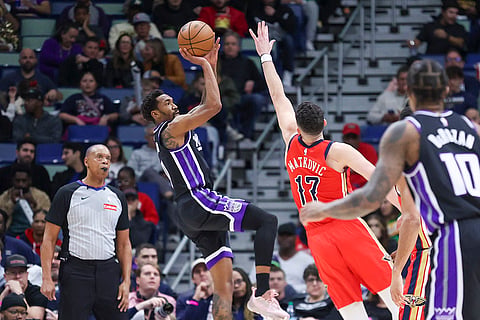 NBA 2024-25: Kings guard Malik Monk (0) shoots a fall away jumper over Pelicans center Karlo Matkovic