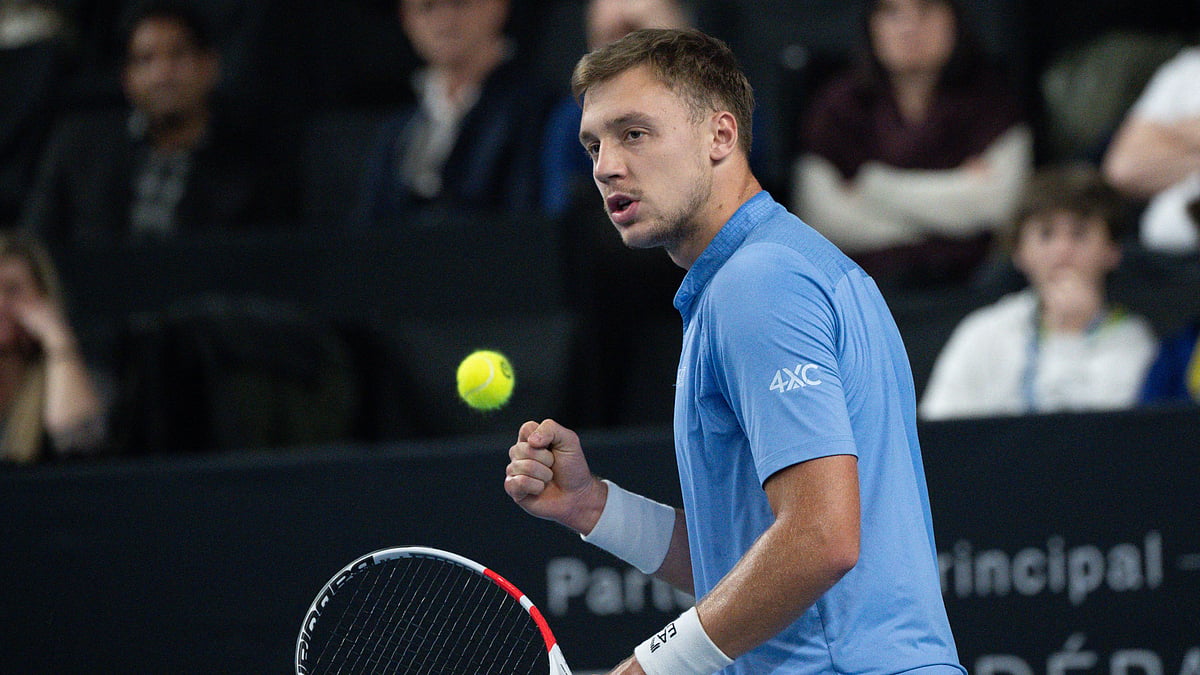 Hamad Medjedovic celebrates after winning a point against Daniil Medvedev