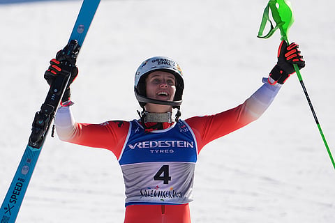 Austria Ski Worlds:  Camille Rast celebrates winning the gold medal 