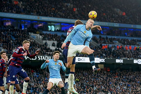 Premier League 2024-25: Manchester City's Erling Haaland heads the ball to serve teammate James McAtee
