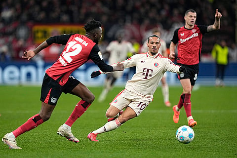 Bundesliga 2024-25: Bayern's Leroy Sane in action against Leverkusen's Edmond Tapsoba