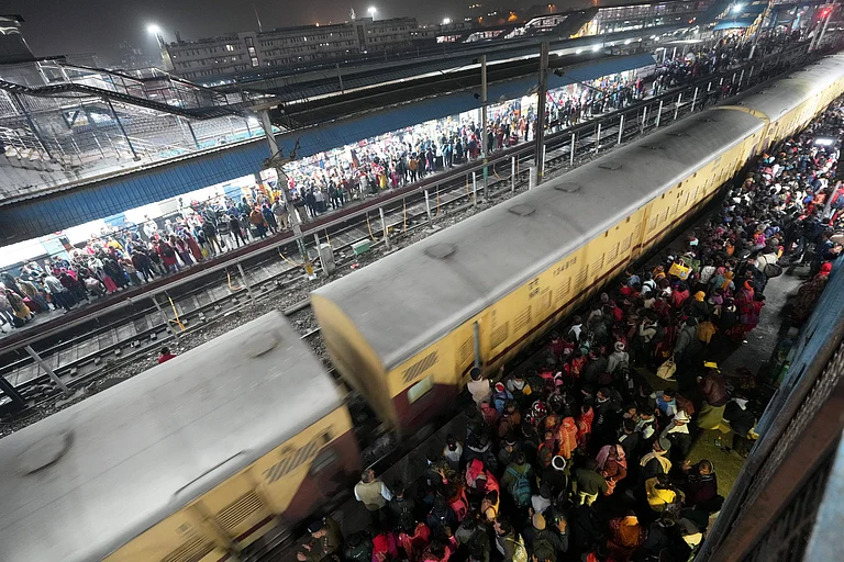Heavy rush of passengers to catch a train for Mahakumbh, at the New Delhi railway station - PTI