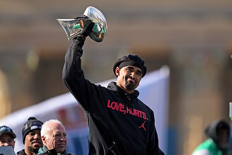Super Bowl Eagles Parade: Eagles quarterback Jalen Hurts holds up the Lombardi trophy