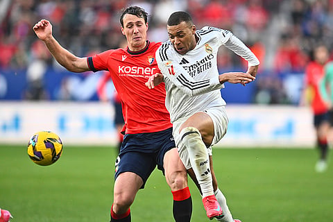 La Liga 2024-25: Real Madrid's Kylian Mbappe is challenged by Osasuna's Jorge Herrando
