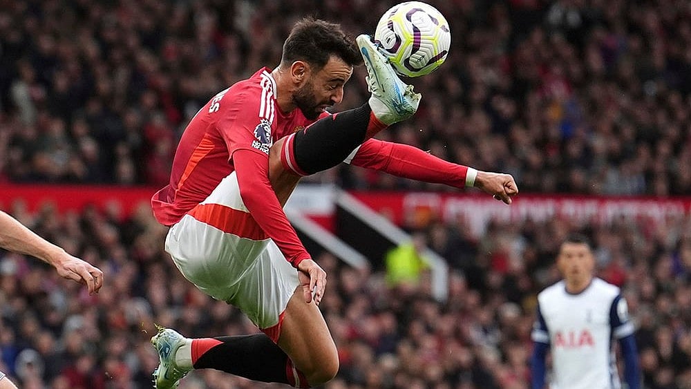 | Photo: Martin Rickett/PA via AP : EPL 2024-25 Man United Vs Tottenham: Manchester United's Bruno Fernandes controls the ball