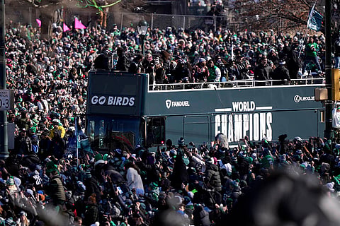 Super Bowl Eagles Parade: Fans looks on as a bus carrying players