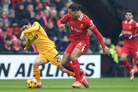 EPL 2024-25: Wolves' Goncalo Guedes challenges for the ball with Liverpool's Virgil van Dijk 