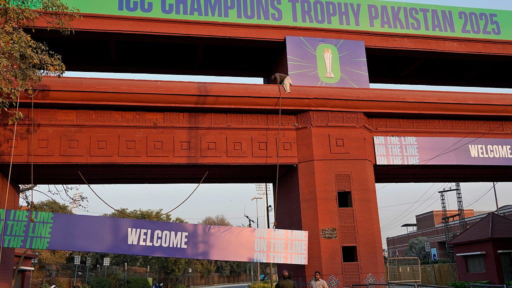 AP : Workers install billboards on a structure of an entry point to Gaddafi Stadium, in preparation for upcoming ICC Champions Trophy 2025 in Lahore.