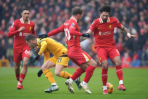EPL 2024-25: Wolves' Pablo Sarabia, second left, challenges for the ball with Liverpool's Alexis Mac Allister