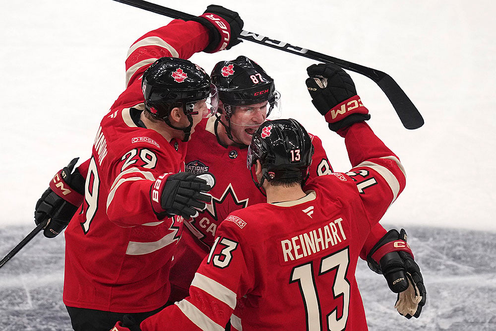 | Photo: AP/Charles Krupa : 4 Nations Face-Off, Canada vs Finland: Canada's Sidney Crosby, center, celebrates after his goal 