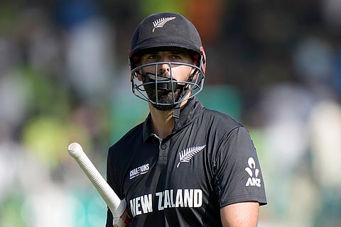 Champions Trophy 2025 Match 1, New Zealand's Daryl Mitchell reacts as he walks off the field 