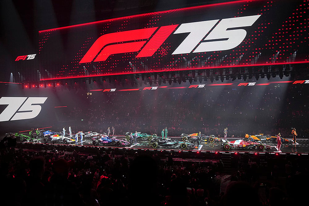 | Photo: AP/Kin Cheung : F1 75 Live launch event: Drivers stand next to their cars