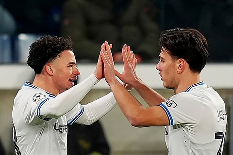 Champions League Soccer playoff second leg: Brugge's scorer Chemsdine Talbi and his teammate Ardon Jashari, right, celebrate the opening goal