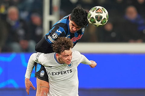 Champions League Soccer playoff second leg: Atalanta's Raoul Bellanova heads the ball over Brugge's Maxim De Cuyper