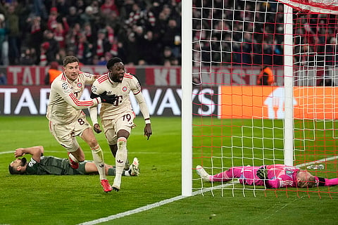 Champions League Soccer playoff second leg: Bayern's Alphonso Davies, centre, celebrates after scoring his side's opening goal 