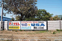 The American Dream: An ad “inviting” people to apply for US visa in a village in Kalol tehsil in Gandhinagar, Gujarat