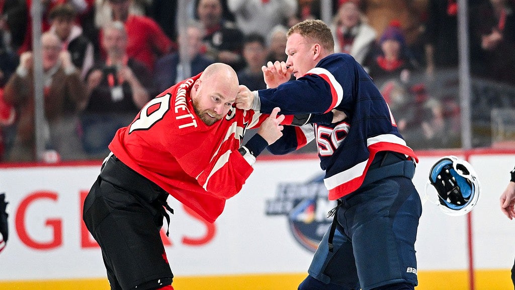 Graham Hughes//The Canadian Press via AP : Canada's Sam Bennett, left, fights with United States' Brady Tkachuk during the first period of a 4 Nations Face-Off hockey game in Montreal on Saturday, Feb. 15, 2025.