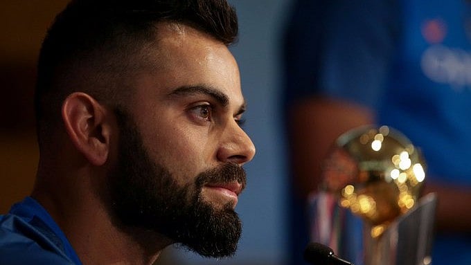 X/ICC : Virat Kohli with the Champions Trophy.