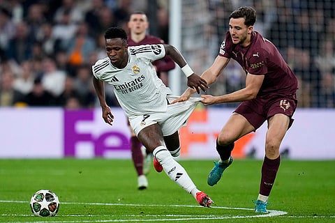 Champions League playoff second leg: Manchester City's Nico Gonzalez challenges Real Madrid's Vinicius Junior 