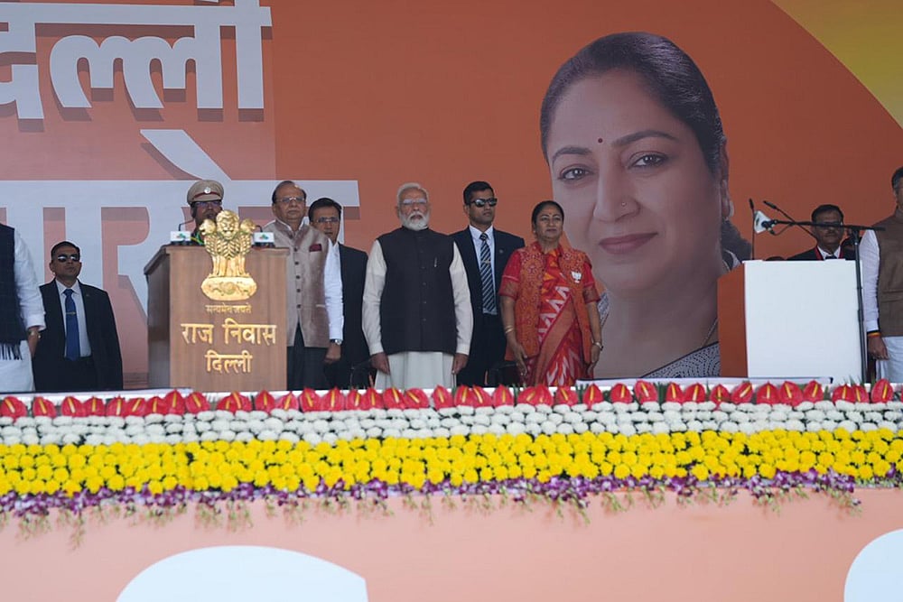 Delhi government swearing-in ceremony_PM Narendra Modi with Rekha Gupta and VK Saxena