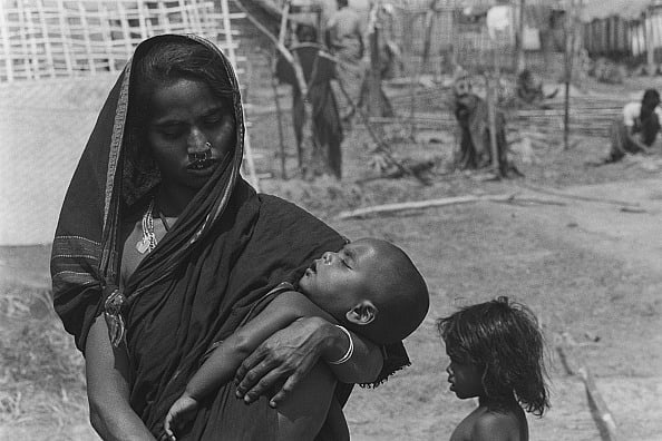 Santosh BASAK/Gamma-Rapho via Getty Images : The Survivors of Nellie's Village in 1983