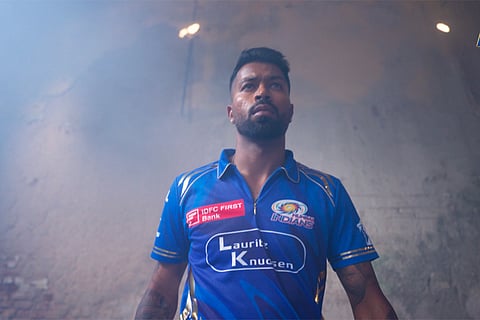 Mumbai Indians captain Hardik Pandya with the new jersey of the team ahead of the Indian Premier League 2025 season