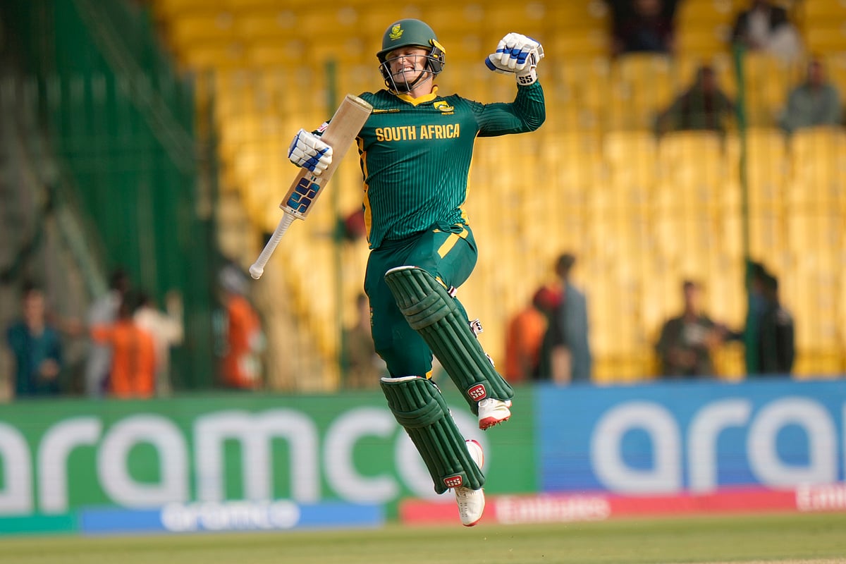(AP Photo/Anjum Naveed) : South Africa's Ryan Rickelton celebrates after scoring century during the ICC Champions Trophy cricket match between Afghanistan and South Africa, in Karachi, Pakistan Friday, Feb. 21, 2025. 
