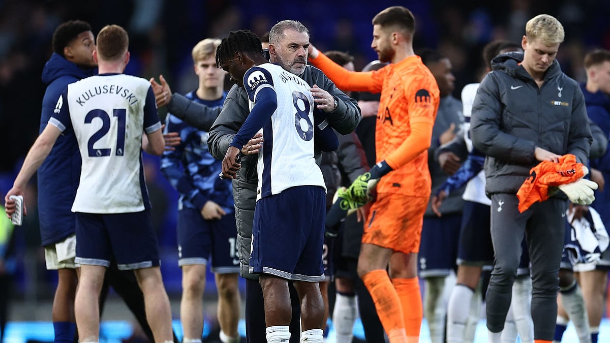 Postecoglou celebrates with his players at full-time