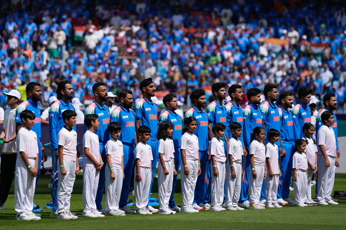 Players of India stands for their national anthem before the start of ICC Champions Trophy cricket match between India and Pakistan at Dubai International Cricket Stadium, United Arab Emirates, Sunday, Feb. 23, 2025.