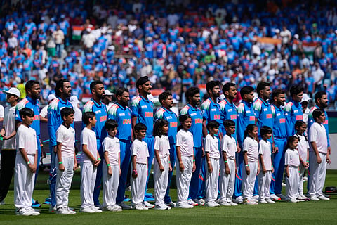 Players of India stands for their national anthem before the start of ICC Champions Trophy cricket match between India and Pakistan at Dubai International Cricket Stadium, United Arab Emirates, Sunday, Feb. 23, 2025.