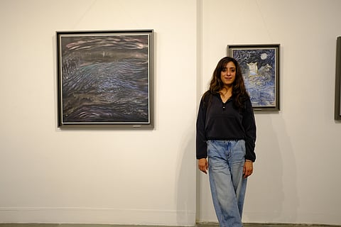Artist Gauri Sharma with her exhibited artworks |