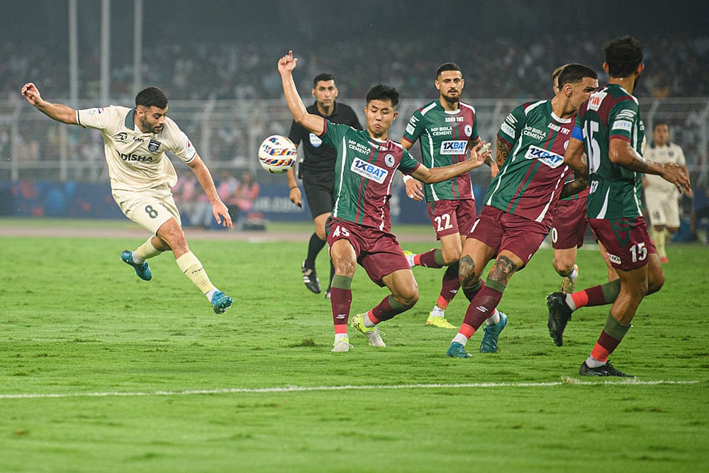 Odisha FC midfielder Hugo Boumous heads the ball during the ISL match against Mohun Bagan