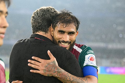 Mohun Bagan Super Giant skipper Subhasish Bose embraces head coach Jose Molina after the win