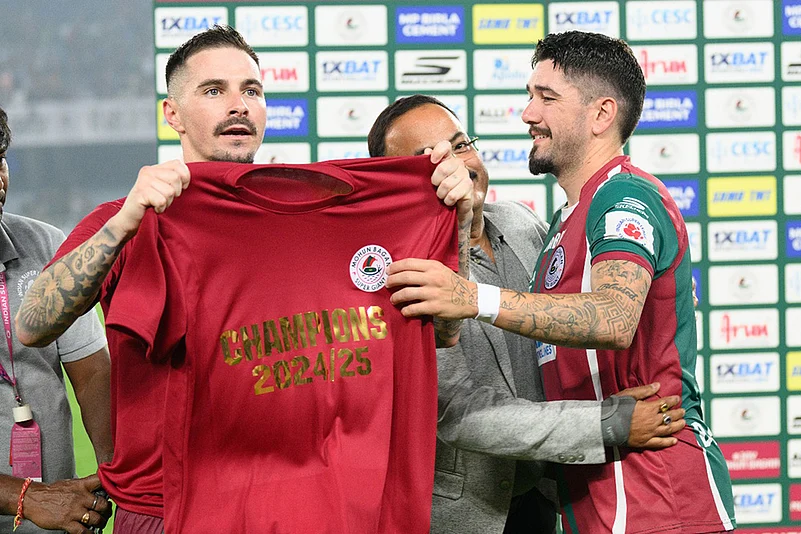 Dimitrios Petratos (right) and Jamie Maclaren celebrate after Mohun Bagan retain the ISL Shield