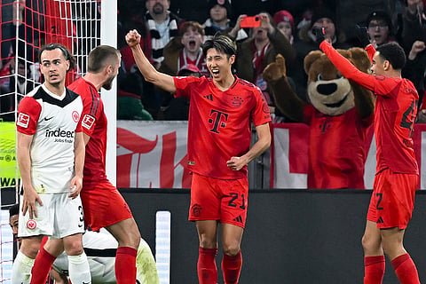 Bundesliga 2024-25, Bayern vs Eintracht: Munich's Hiroki Ito, center, celebrates scoring 