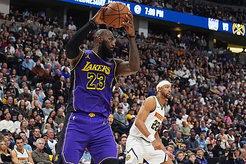 NBA 2024-25, Lakers vs Nuggets: Lakers forward LeBron James pulls in a rebound 