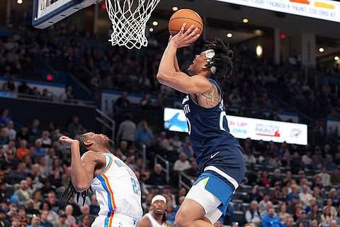 NBA 2024-25, Timberwolves vs Thunder: Timberwolves guard Terrence Shannon Jr., right, looks to shoot
