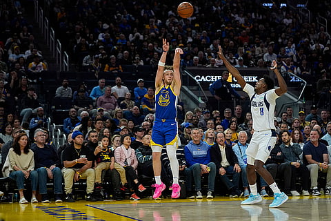 NBA 2024-25, Mavericks vs Warriors: Warriors guard Brandin Podziemski (2) shoots a 3-point basket