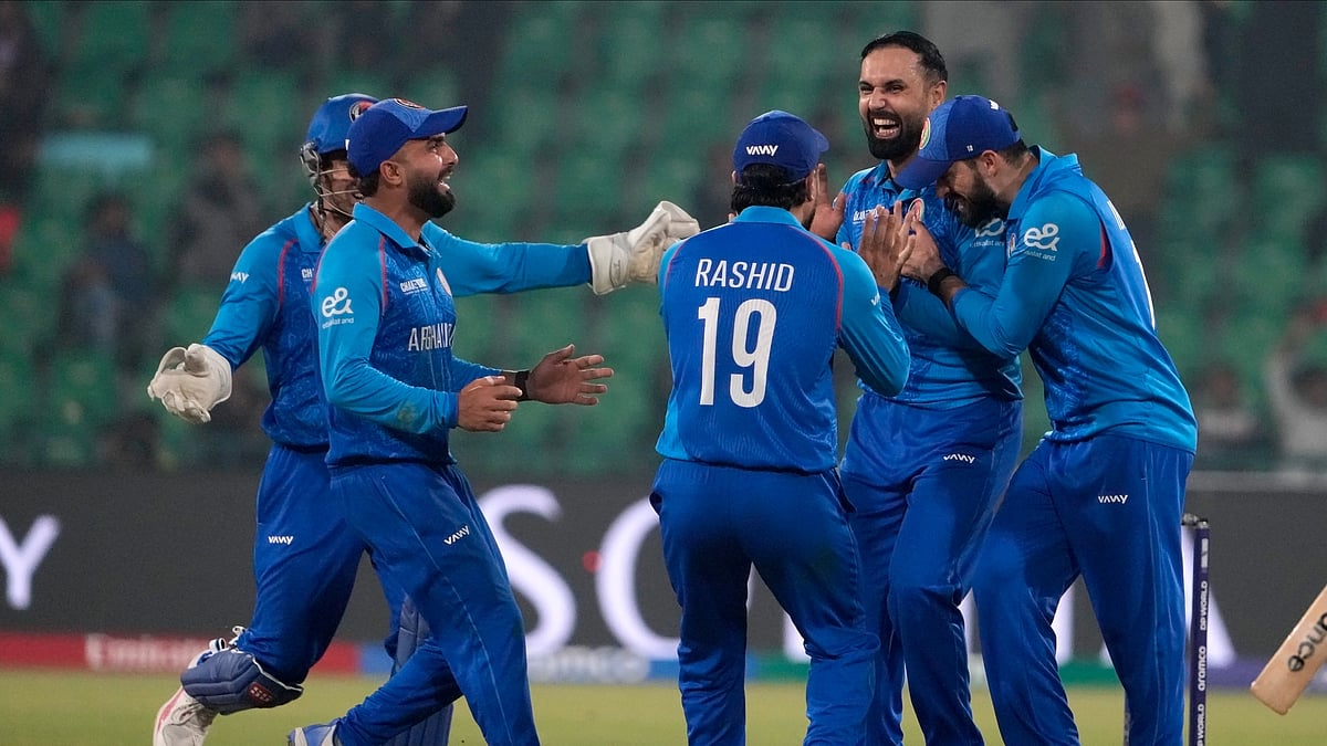 AP/Photo/K.M. Chaudary : Afghanistan's Mohammad Nabi, second right, celebrates with teammates after dismissal of England's Harry Brook during the ICC Champions Trophy cricket match between Afghanistan and England, in Lahore.