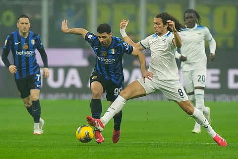 Coppa Italia, Inter vs Lazio: Lazio's Matteo Guendouzi challenges for the ball with Inter Milan's Mehdi Taremi