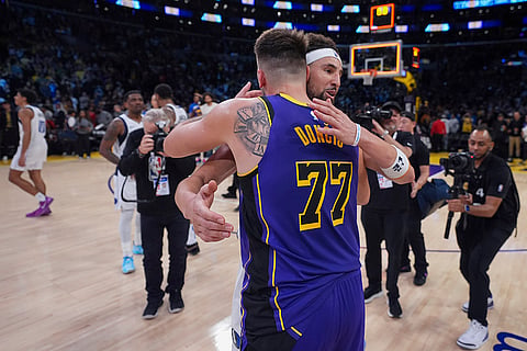 NBA 2024-25: Lakers guard Luka Doncic (77) and Mavericks guard Klay Thompson (31) hug after the match