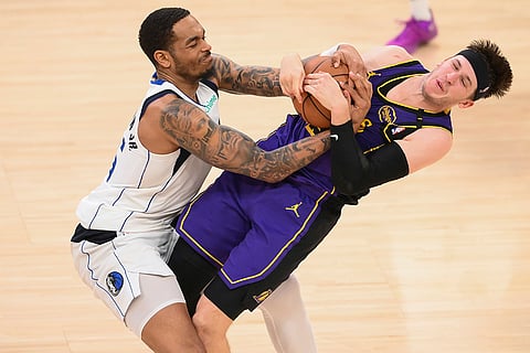 NBA 2024-25: Mavericks forward P.J. Washington, left, and Lakers guard Austin Reaves compete for the ball
