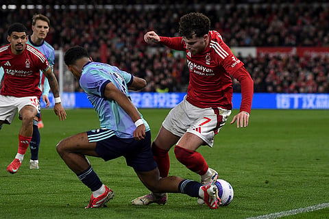 EPL 2024-25: Nottingham Forest's Neco Williams and Arsenal's Jurrien Timber fight for the ball