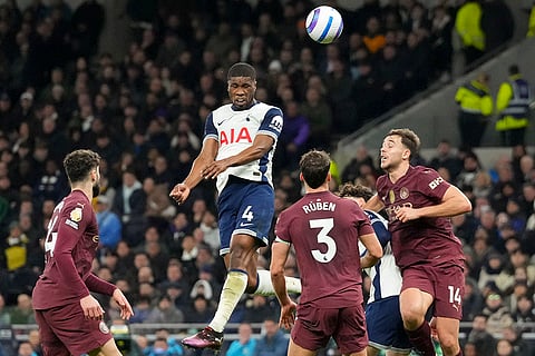 EPL 2024-25: Tottenham's Kevin Danso attempts a header on goal