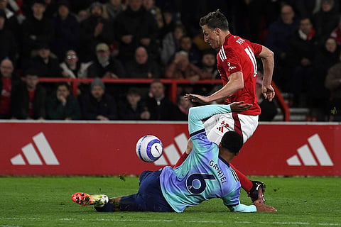 EPL 2024-25: Nottingham Forest's Chris Wood and Arsenal's Gabriel fight for the ball