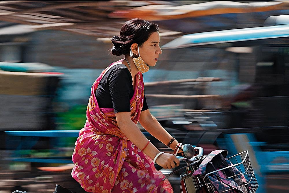 | Courtesy: IMDB : Burning Bright: Maya (Tillotama Shome), caregiver to her ailing husband, struggles to support her family unit in Baksho Bondi 