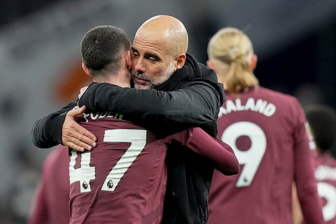 EPL 2024-25: Manchester City's Phil Foden hugs Manchester City's head coach Pep Guardiola