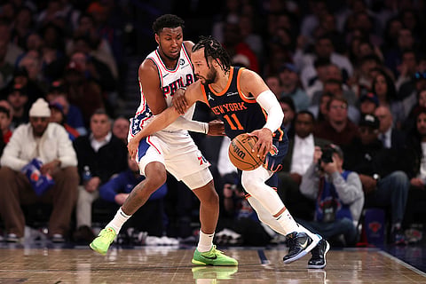 NBA 2024-25: Knicks' Jalen Brunson dribbles the ball against 76ers' Justin Edwards