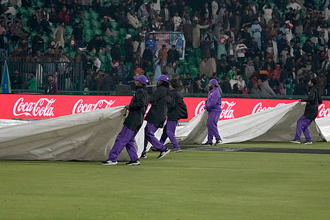 ICC Champions Trophy, AFG vs AUS: Groundsmen cover the pitch and other area